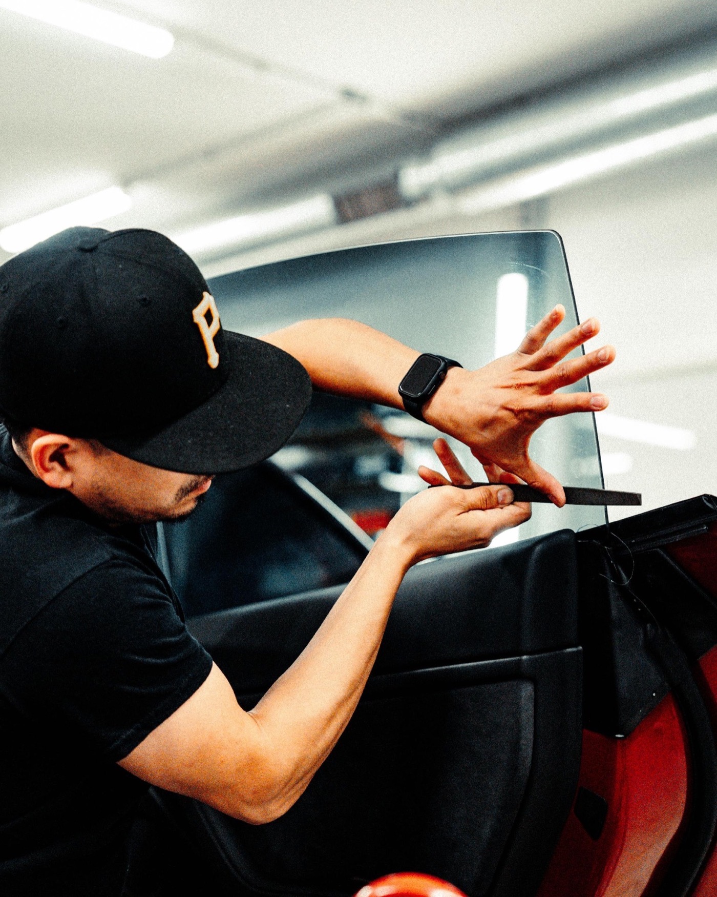 Technician applying window film